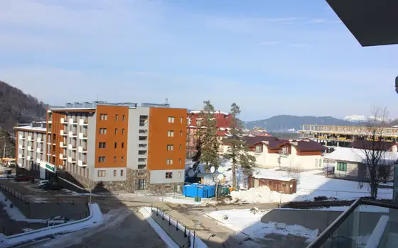Новый жилой дом гостиничного типа ,,Орби Палас,,в горнолыжном курорте в Бакуриани. Апартаменты с видом на горы. Бакуриан
