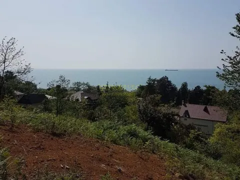 Продается инвестиционный земельный участок с видом на море и горы у ботанического сада в Чакви.